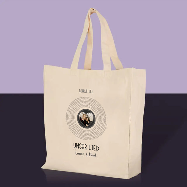 Foto und Bildunterschrift: Unser Lied mit Text – Canvas-Tasche | DE